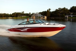 Two people riding in a Monterey Boats M Series during the Holidays.